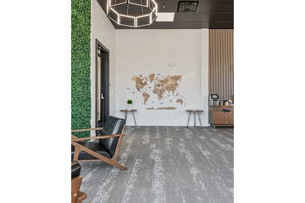 A room with a world map on the wall and a green plant on the left side. at 605 Place Student Housing & Co-Living, St George
